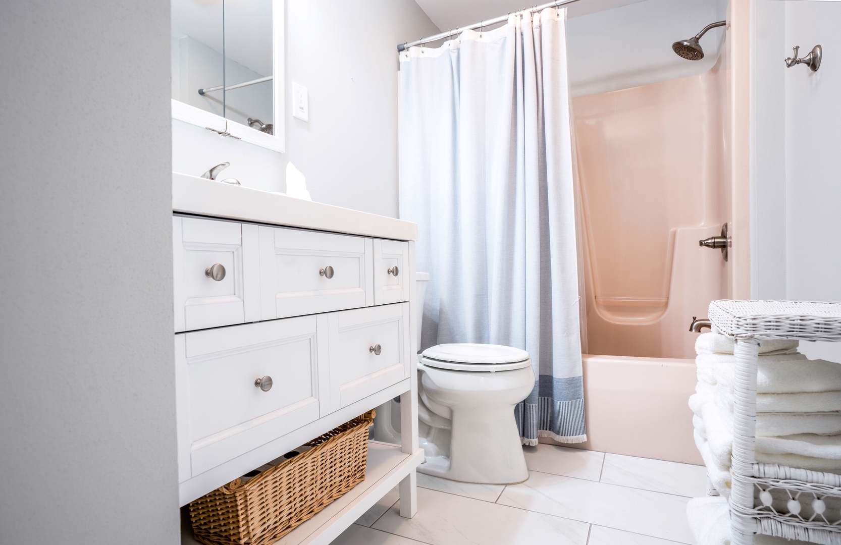 The shared full bath on the 1st floor includes a single vanity & shower/tub combo