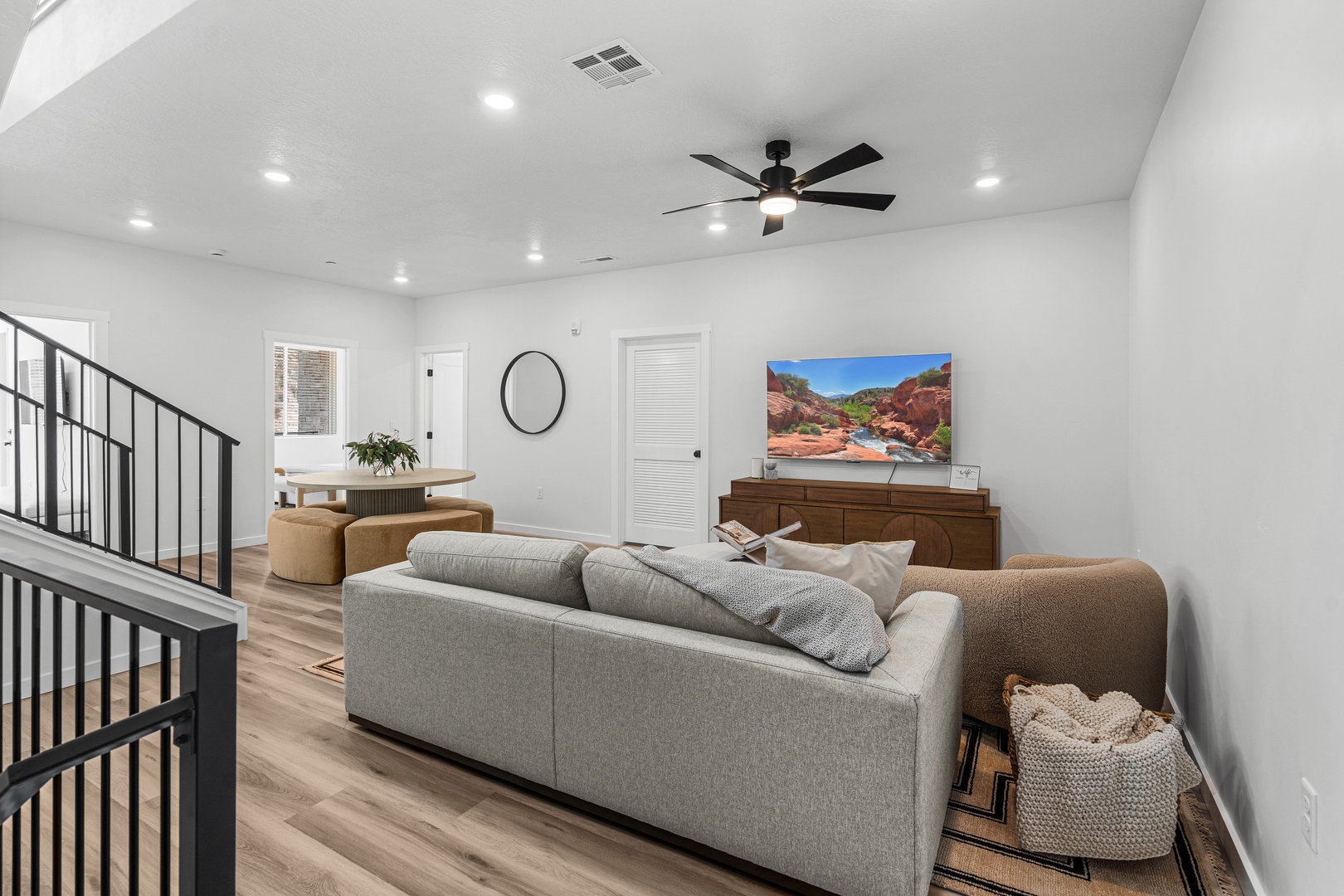 Bottom floor living area with cozy seating and Smart TV