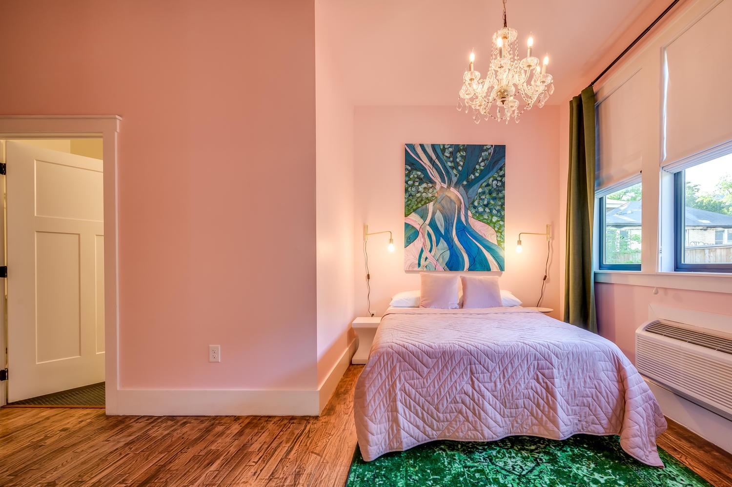 Suite 103 – The Accessible 1st Floor Chandelier Canopy Suite offers a King and Queen Casper Bed, Smart TV, and private Bathroom