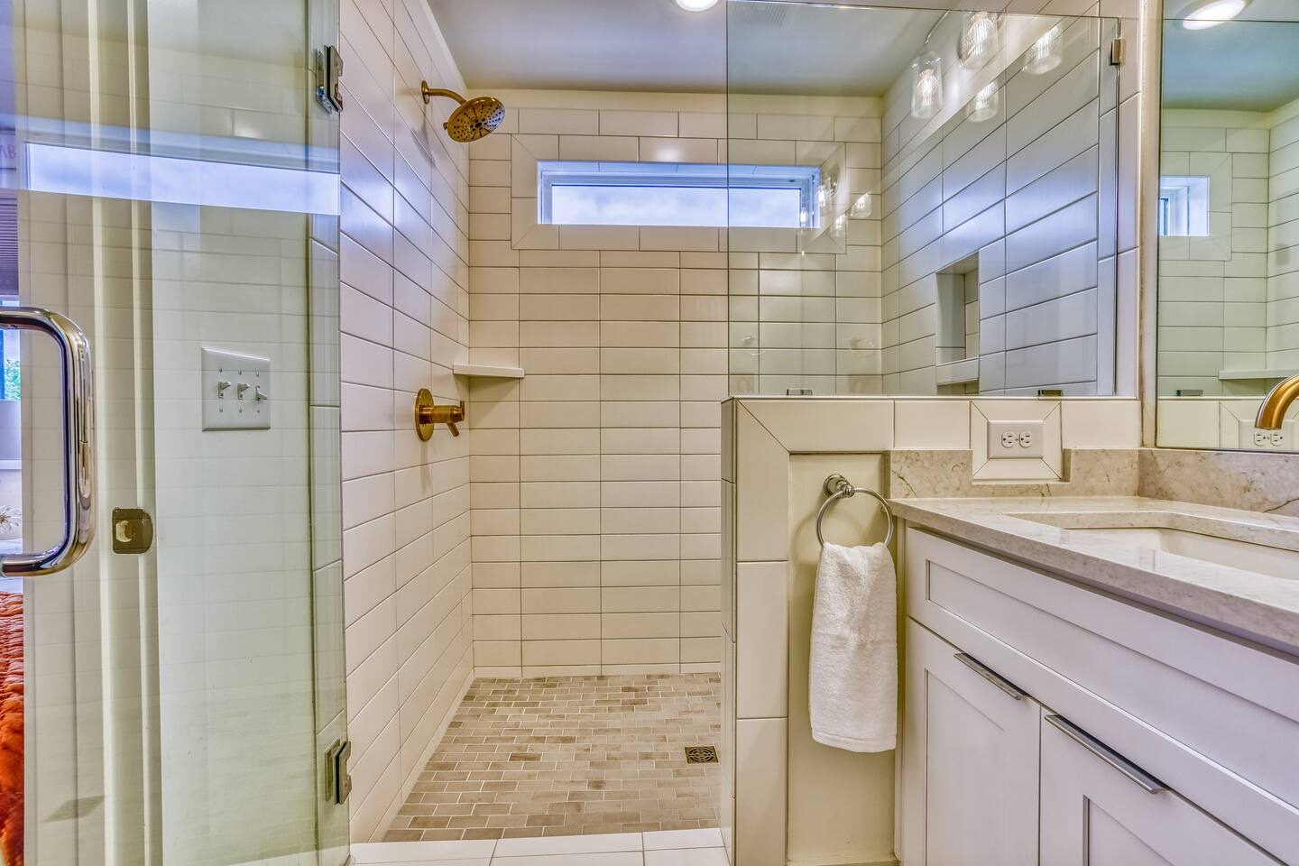 This 3rd floor en suite includes a double vanity & glass walk-in shower