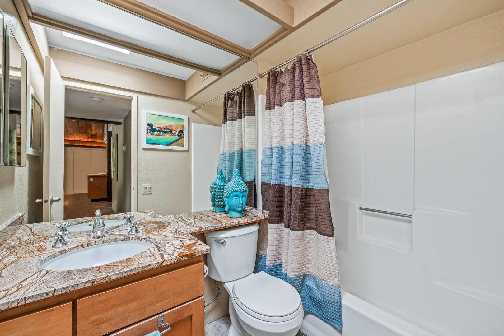 Bathroom 2 offers a shower/tub combo