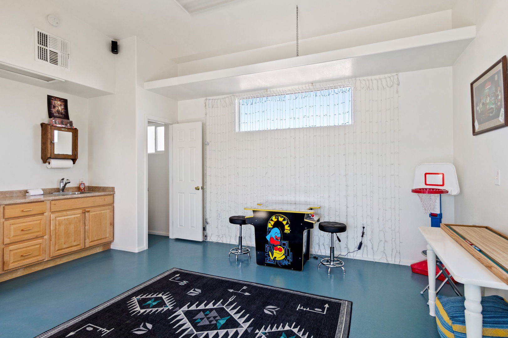Game room with Pac-Man game