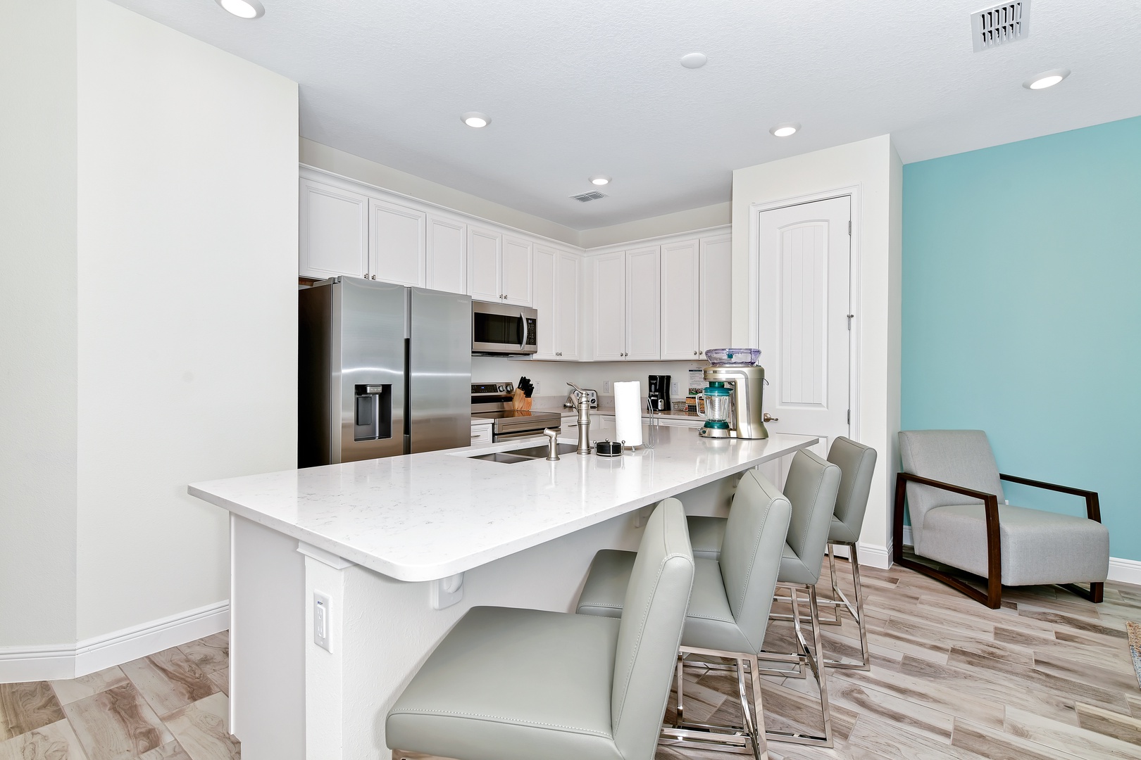 Sip morning coffee or grab a bite at the kitchen counter, with seating for 4