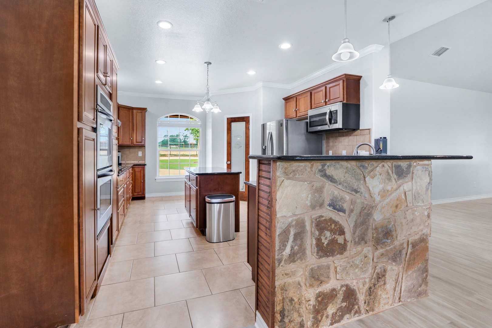 The warm, inviting kitchen offers ample space & all the comforts of home