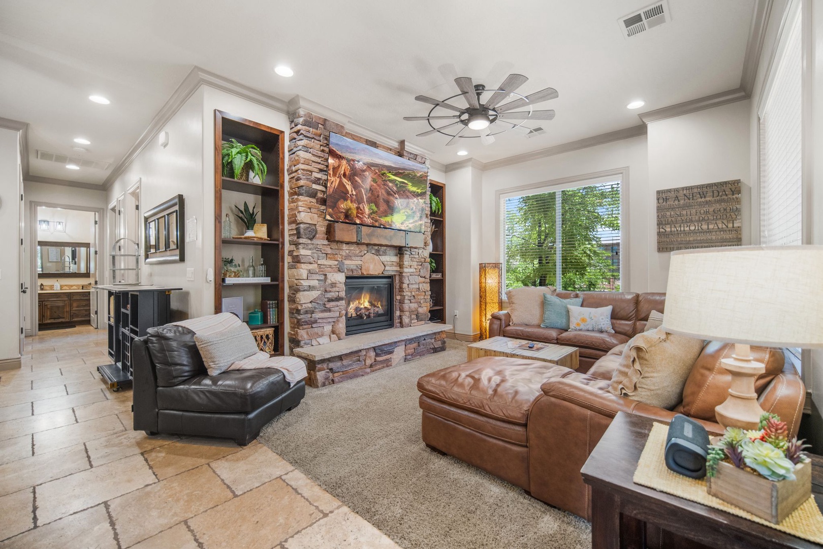 Cozy and spacious living area with TV and fireplace