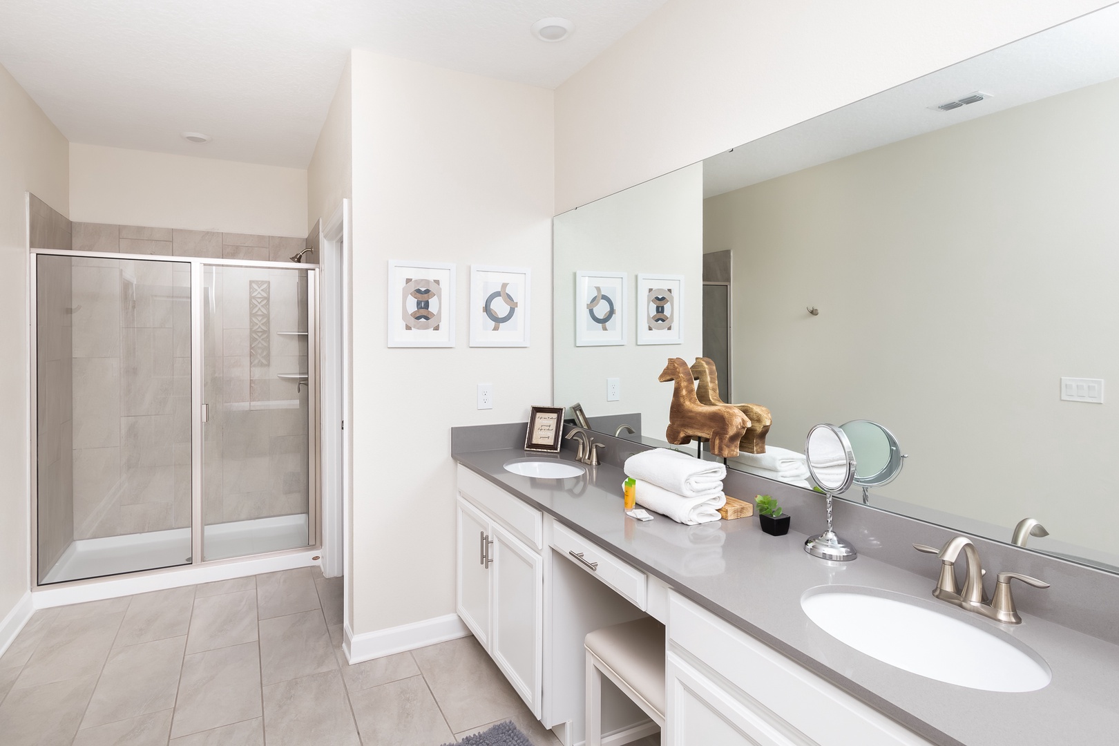 The final ensuite includes a double vanity, shower, & luxurious soaking tub