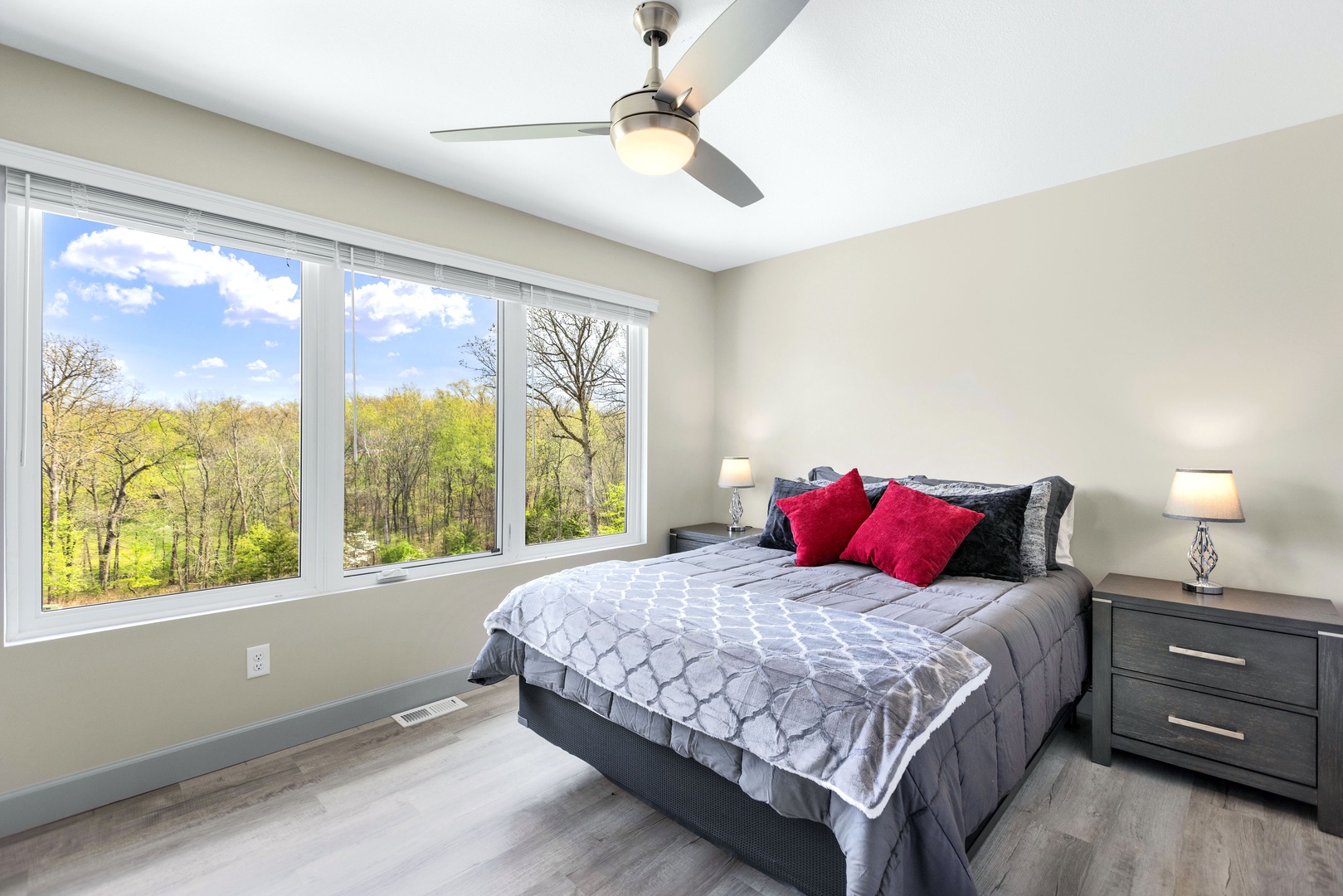 Unwind in the third bedroom furnished with queen bed and nature vistas