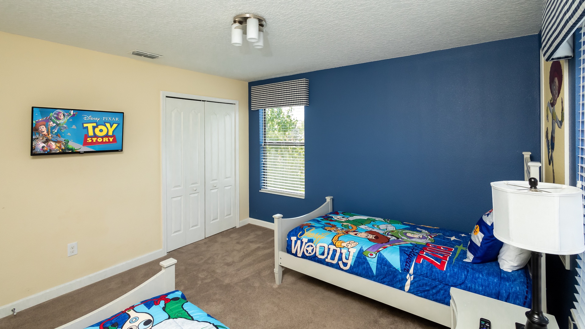 Bedroom 5 Toy Story themed with 2 twin beds, and Smart TV