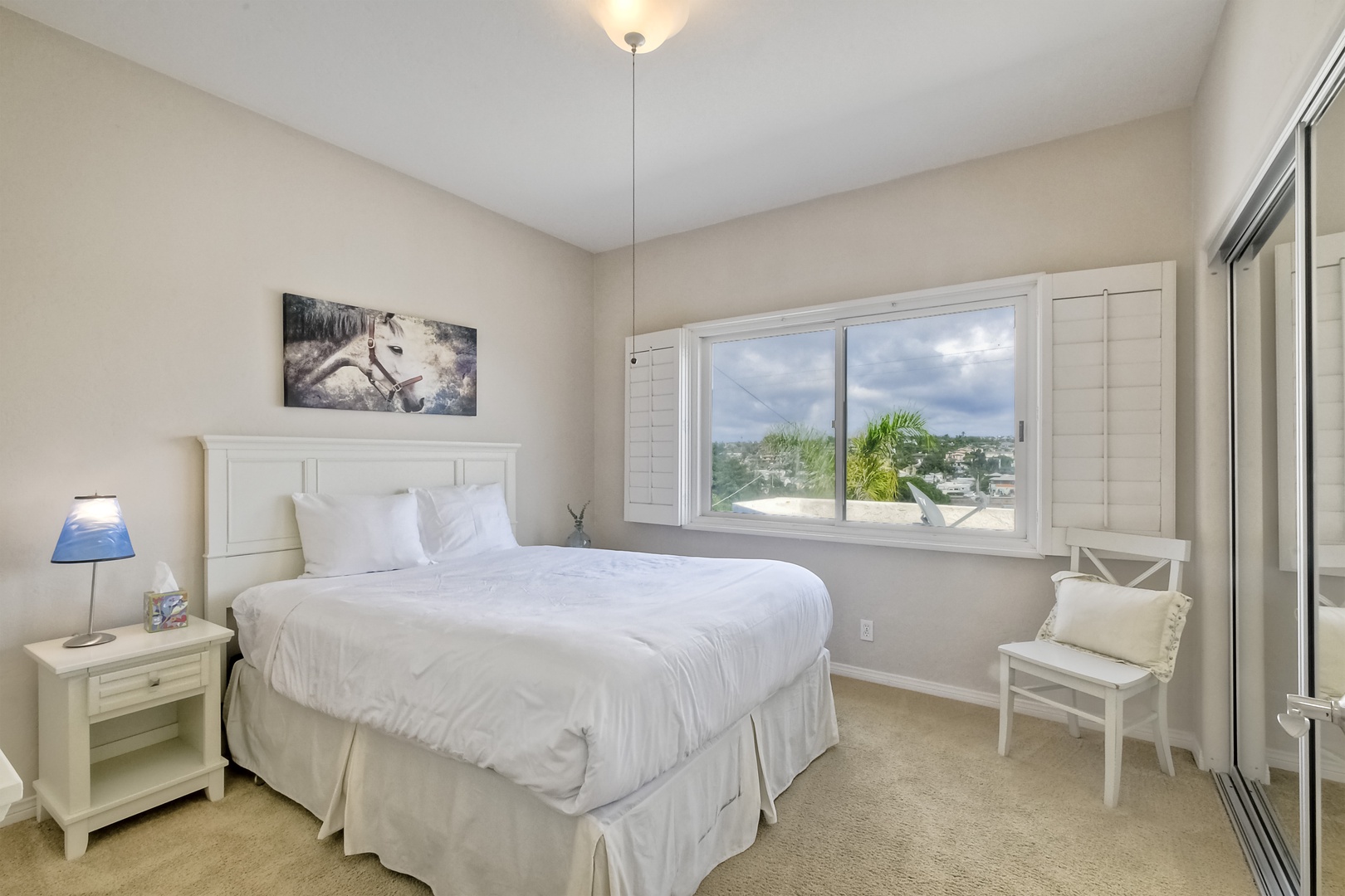 The tranquil 3rd floor bedroom offers a comfy queen bed