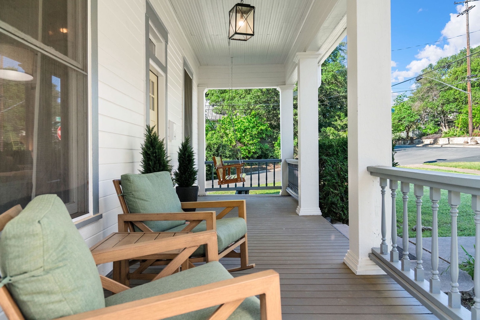 Relax & watch the world go by from the tranquil front porch