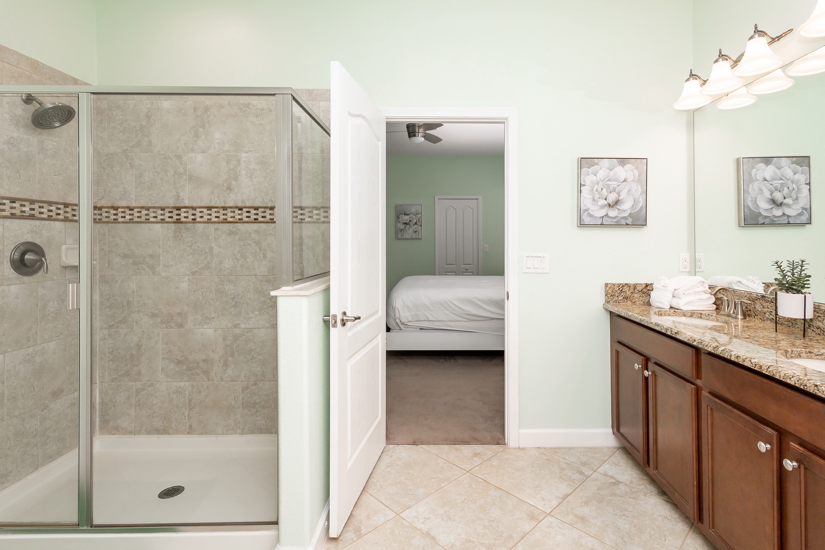 Private ensuite bathroom with dual sinks, separate shower, and soaking tub
