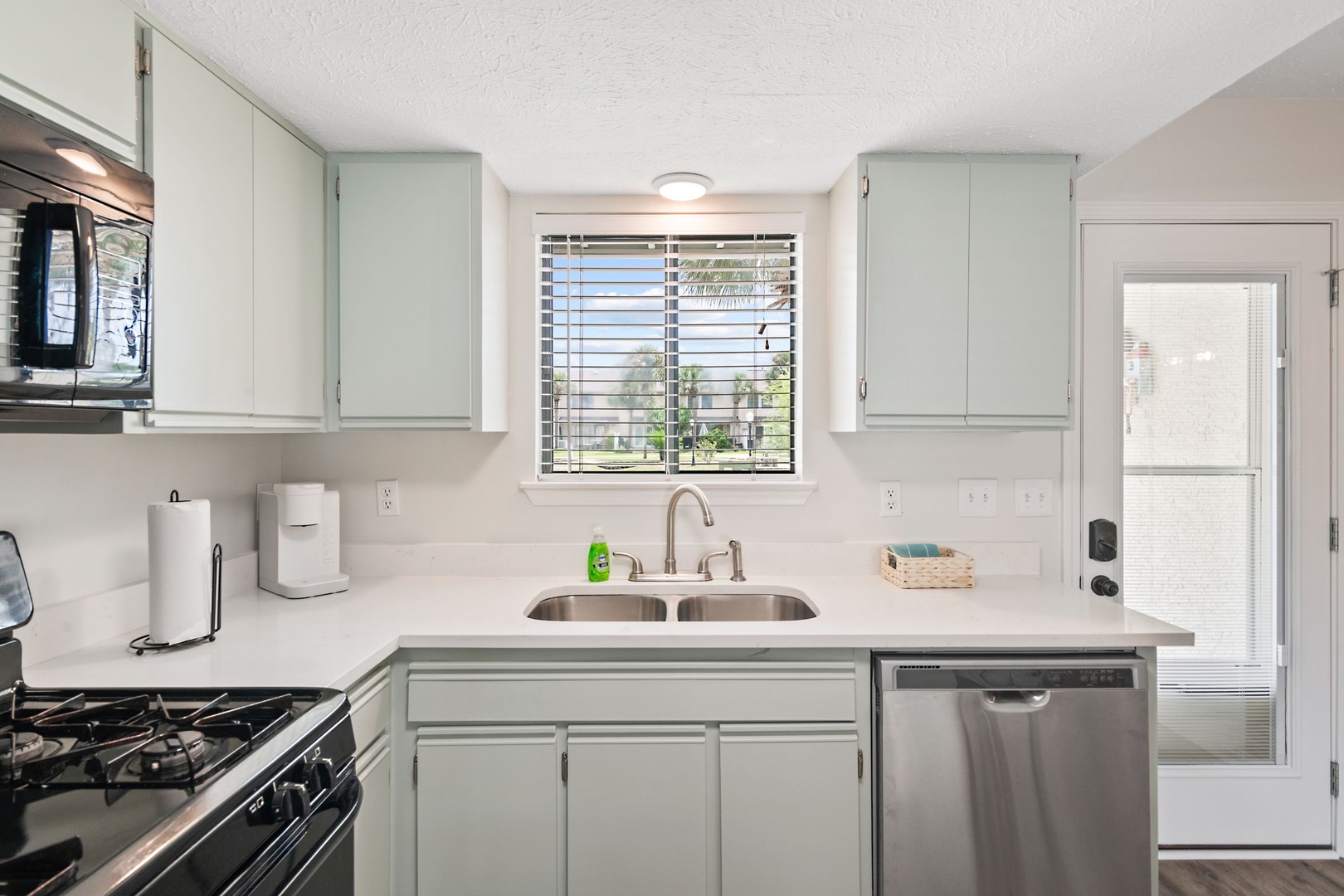 The open, airy kitchen offers ample space & all the comforts of home