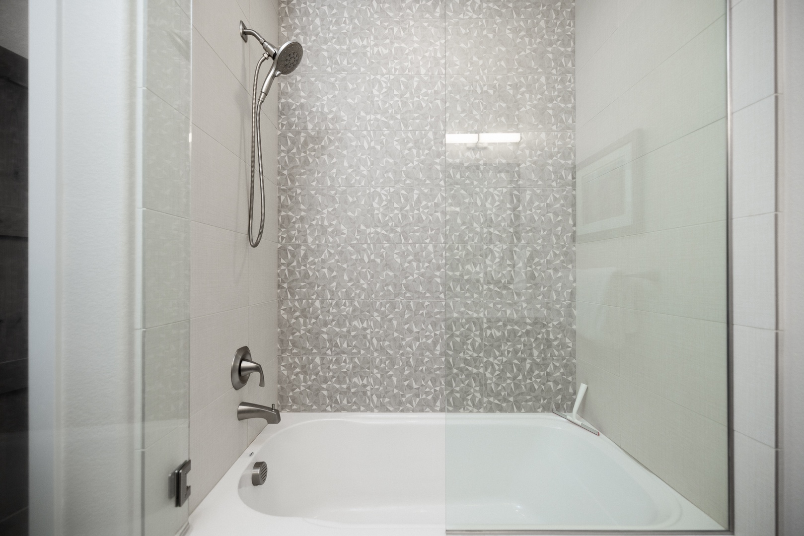 The 2nd-floor hall bath offers a double vanity & shower/tub combo