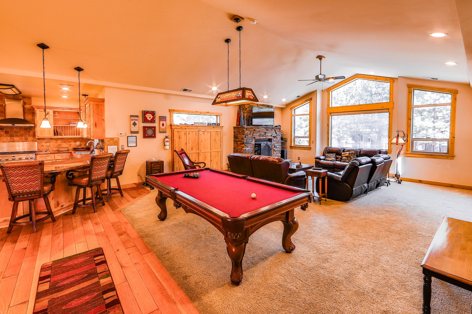 Open concept living room with pool table