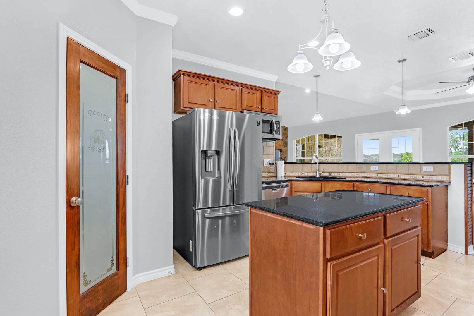 The warm, inviting kitchen offers ample space & all the comforts of home