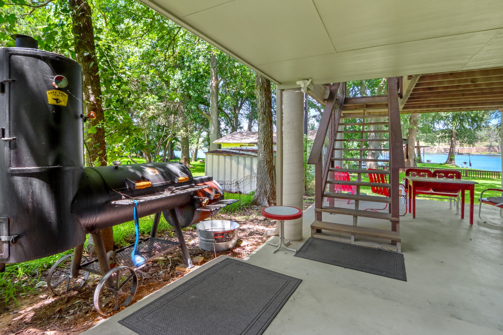 Grillers & meat smoking enthusiasts alike will love the lower-level deck!