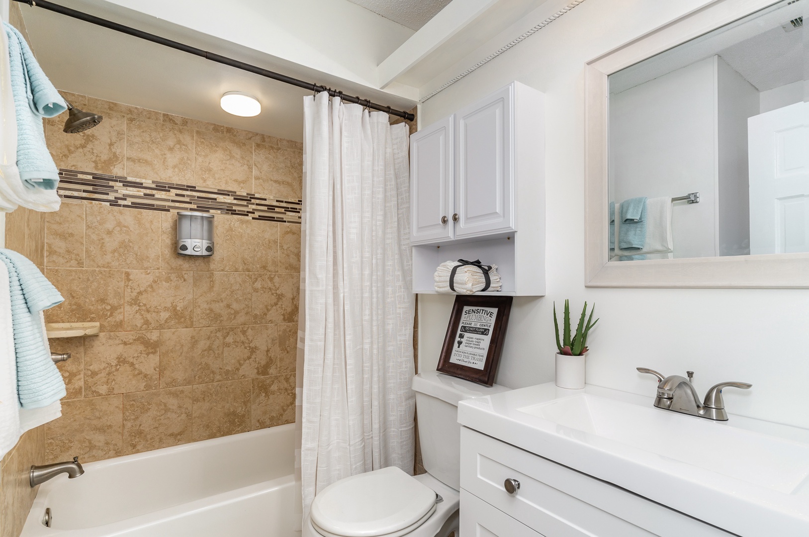 Wash up in the full ensuite, featuring a single vanity & shower/tub combo