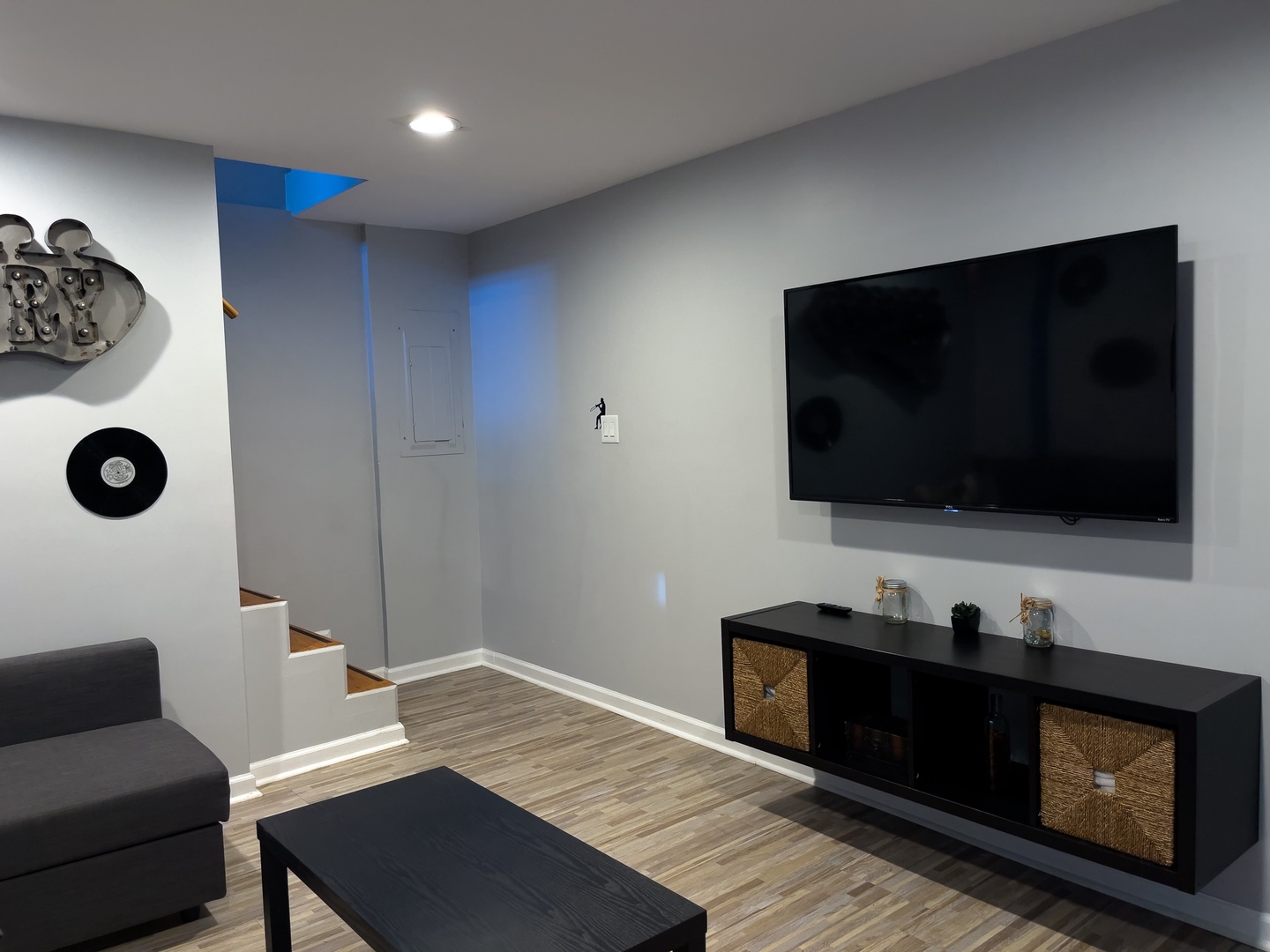 Basement living room with Smart TV, and pull out sofa