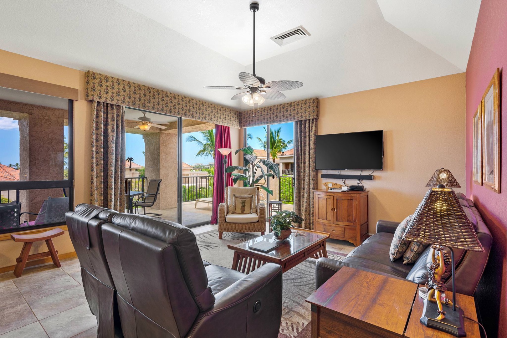 Living room with flat screen TV, comfortable seating and lanai access