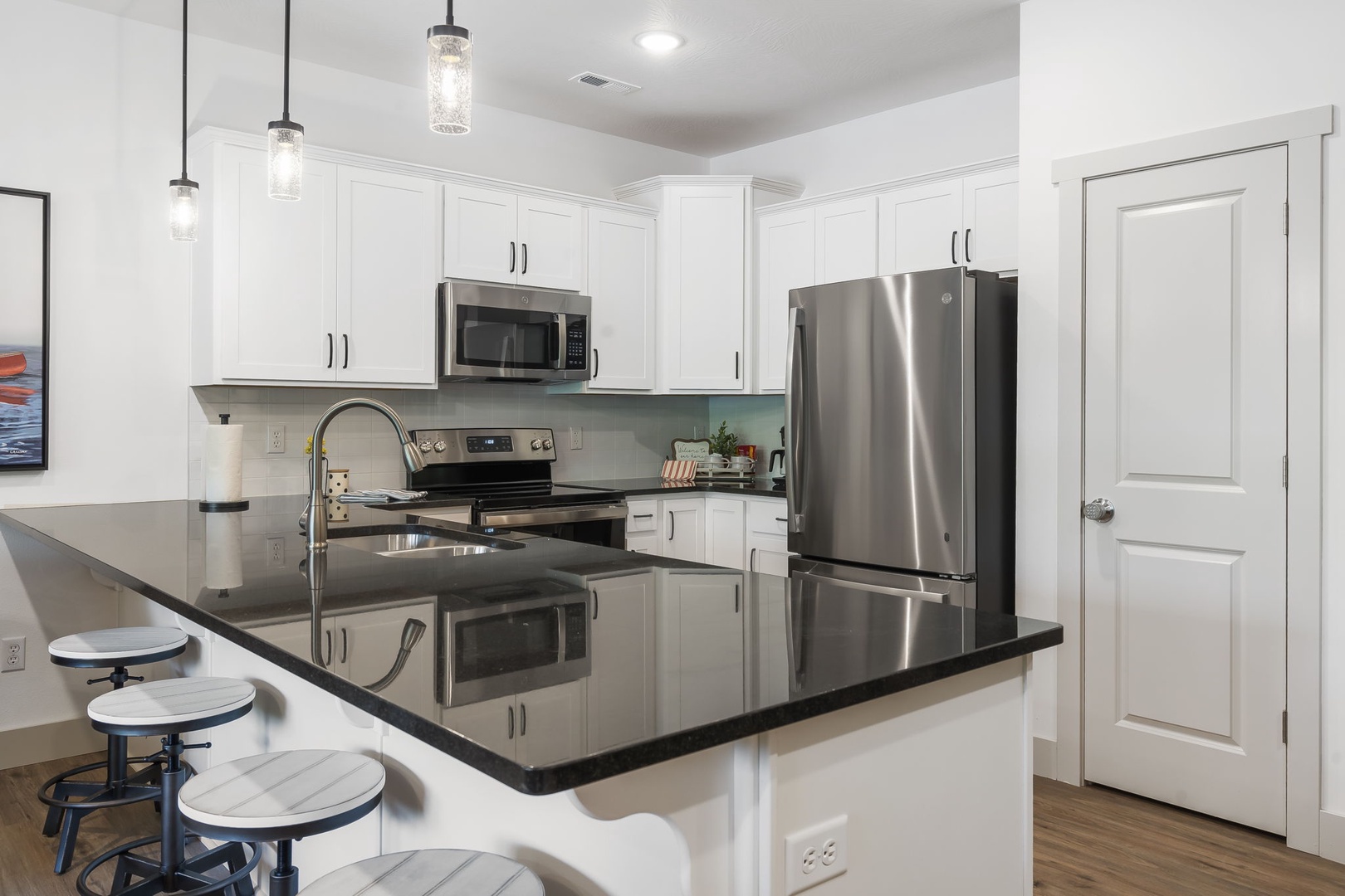 The open kitchen boasts ample counter/storage space and fantastic amenities