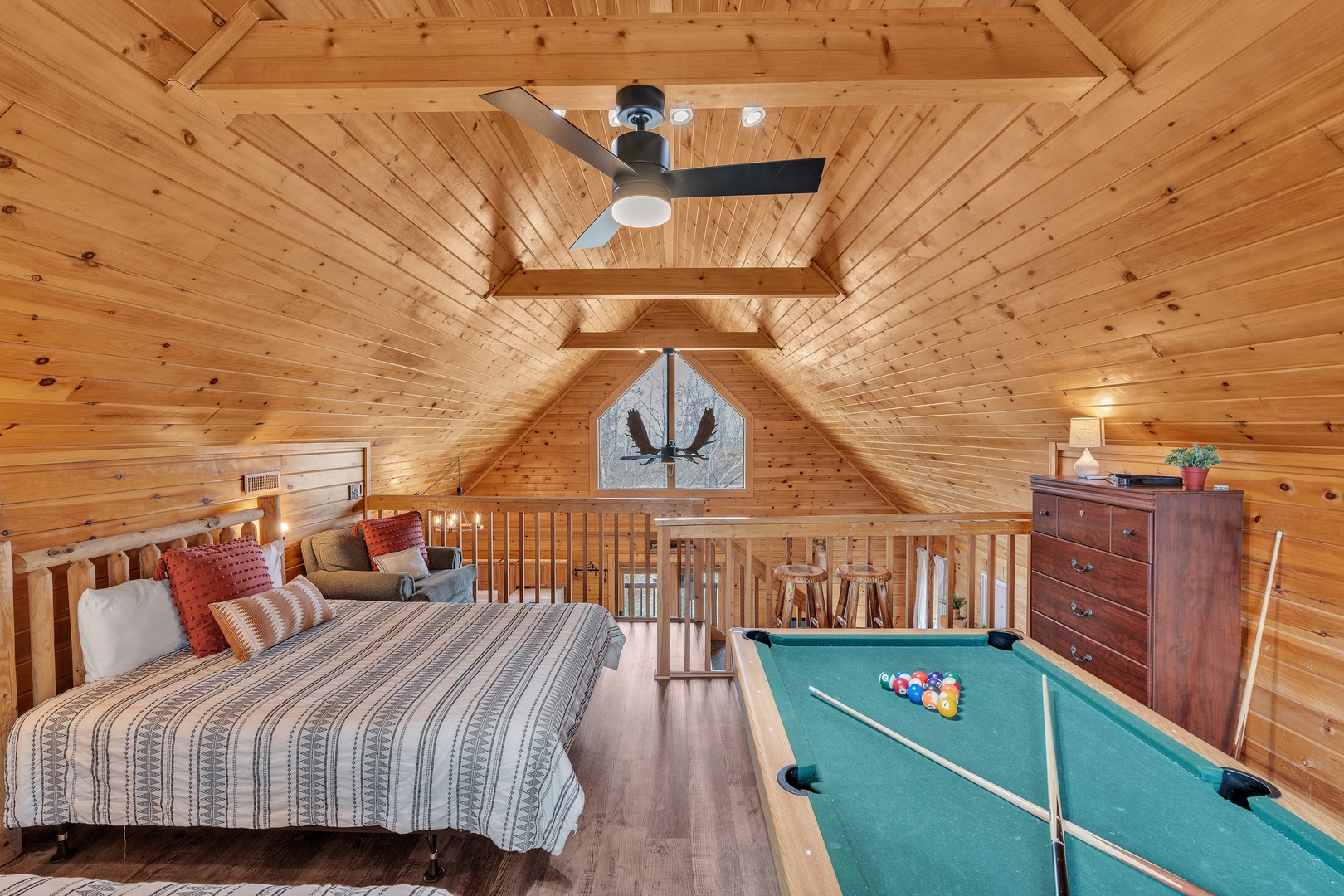 Loft with 2 full beds, pool table, and balcony