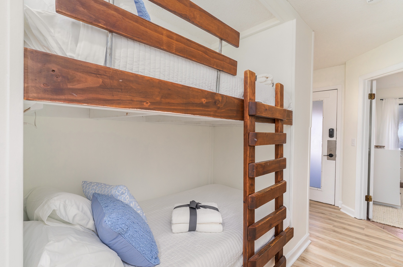 Cozy twin bunks await in the hallway sleeping nook