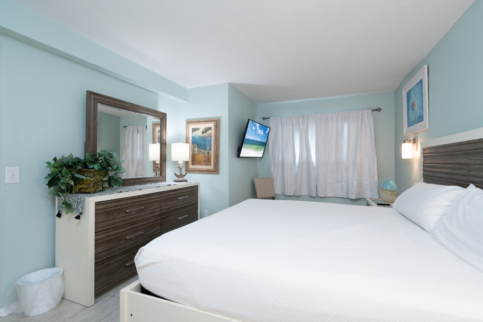 A plush king bed, ensuite bath, & smart TV await in the bedroom retreat