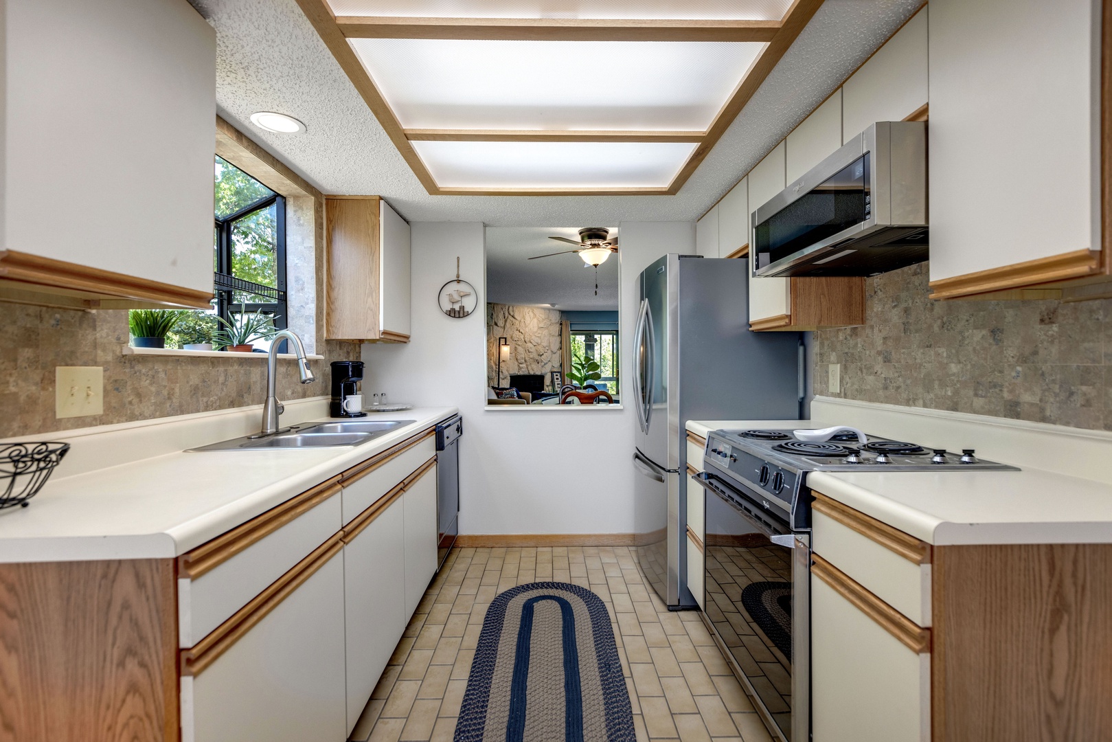 The quaint kitchen offers ample space and all the comforts of home