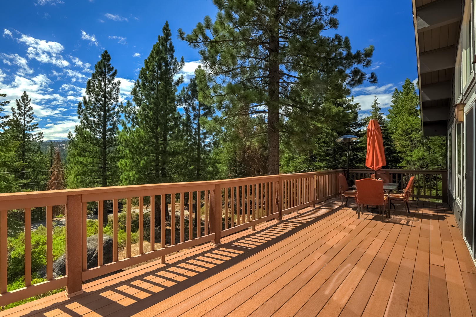Deck with patio seating and mountain views
