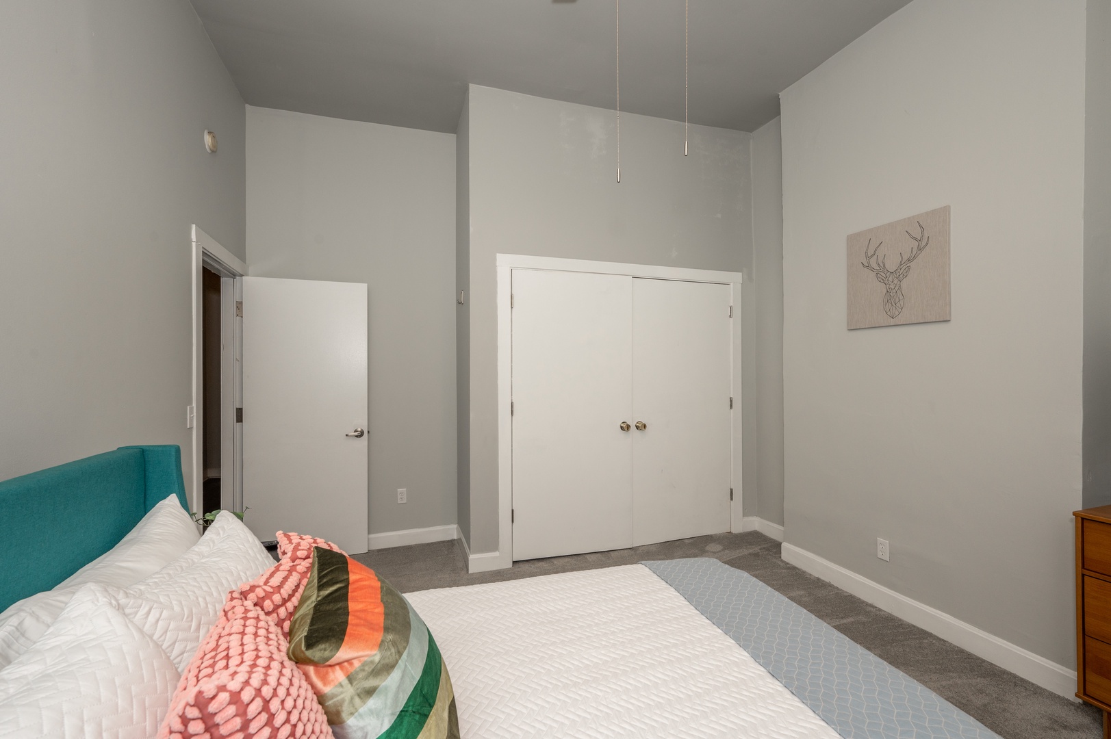 Queen Bedroom with Smart TV, Ceiling Fan, and ample closet space