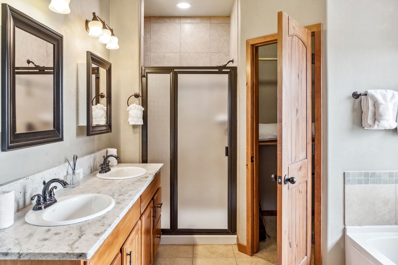 Wash up in the king ensuite, with a double vanity, shower, & soaking tub