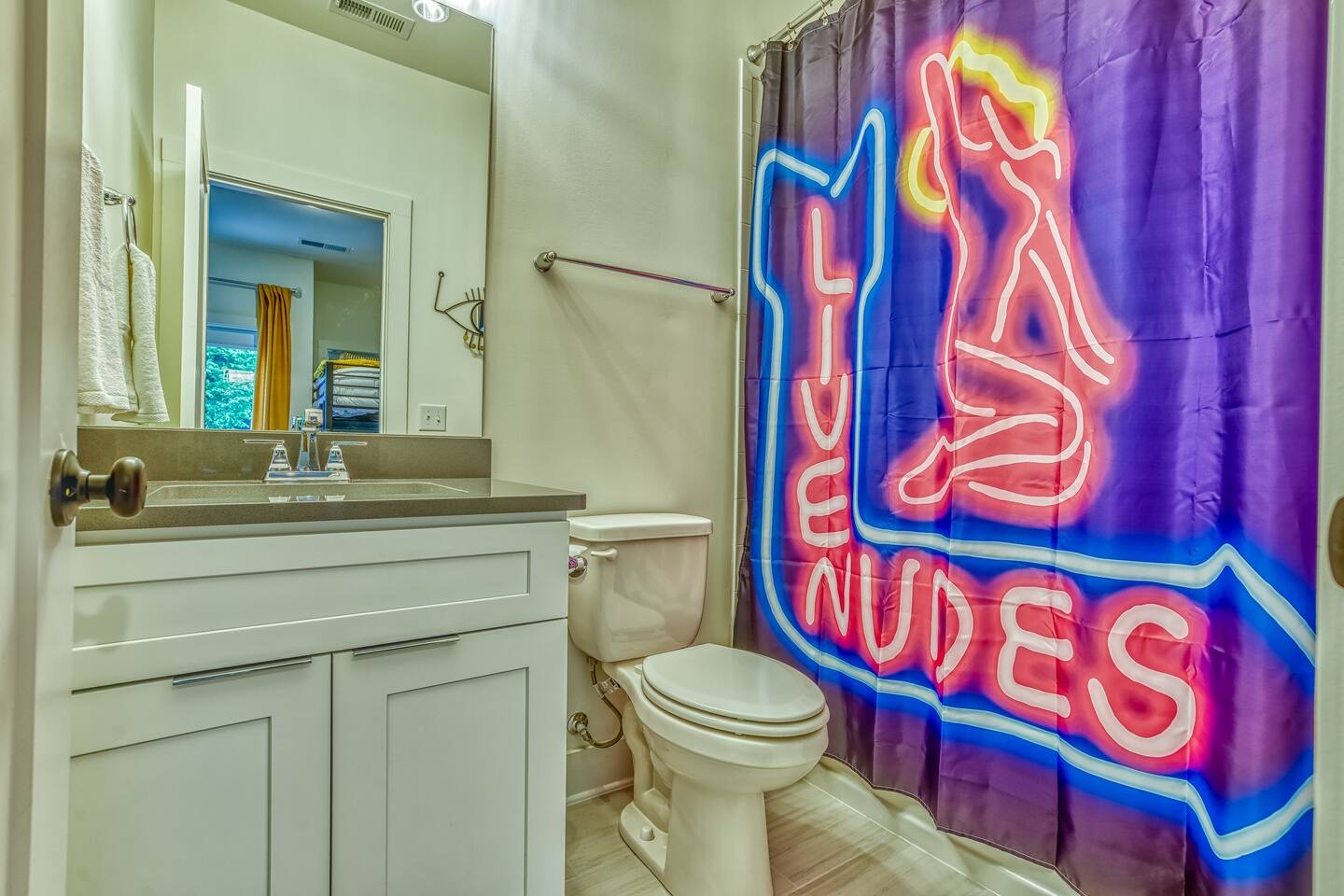 The 1st-floor en suite offers a single vanity & shower/tub combo