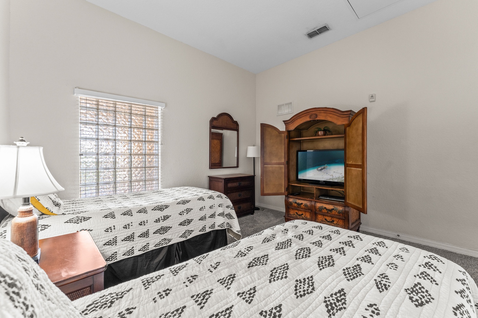 This bedroom retreat features two cozy twin beds