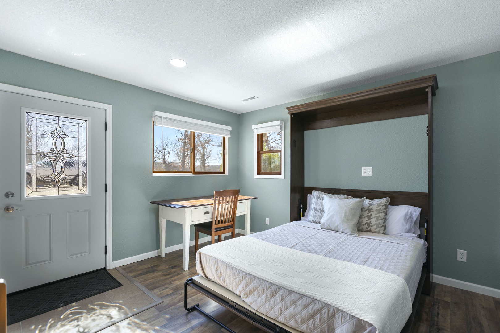 This spacious room can be utilized as an office or as additional sleeping with the queen murphy bed