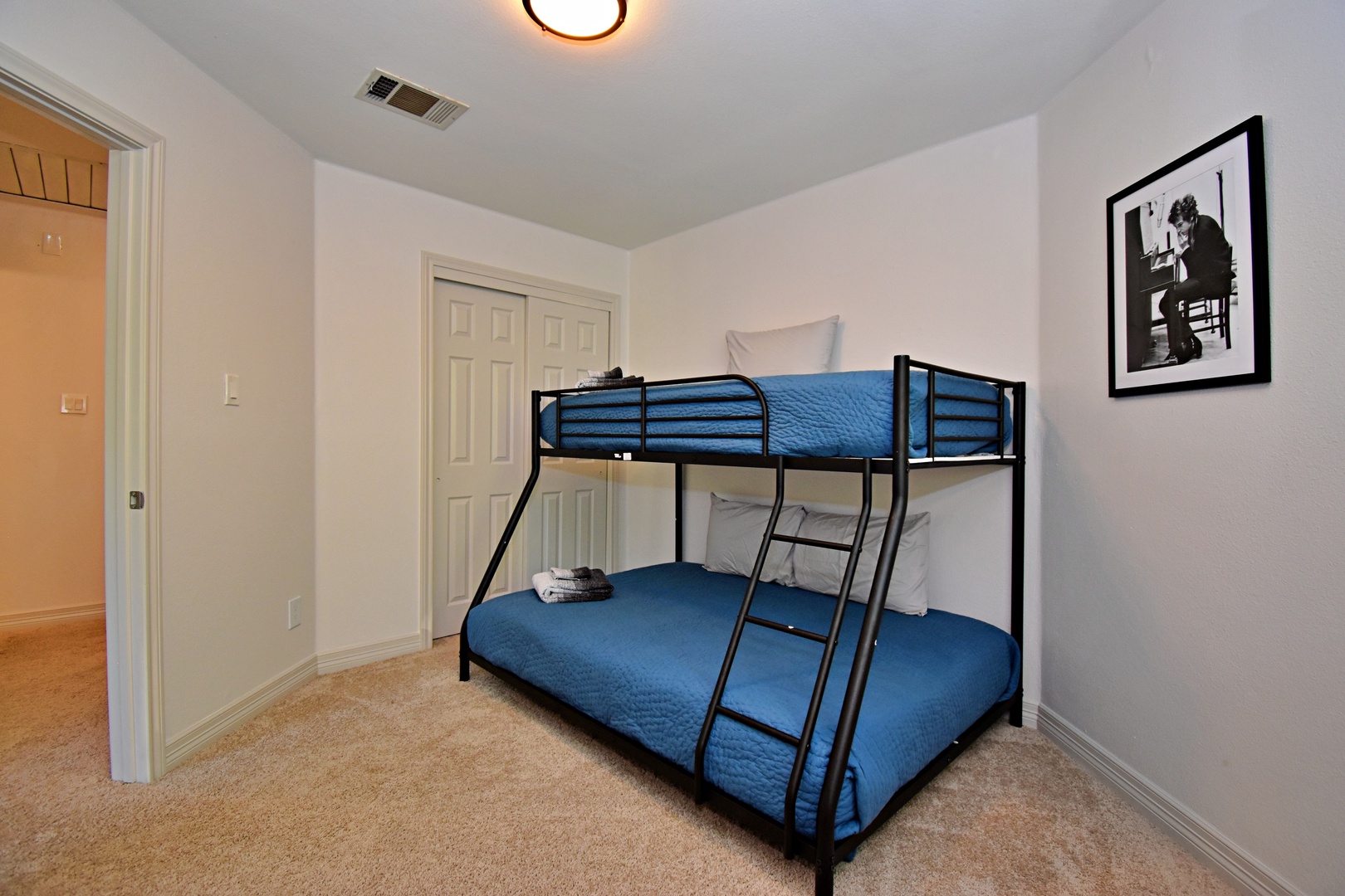 The third bedroom offers a cozy twin-over-full bunkbed & Smart TV
