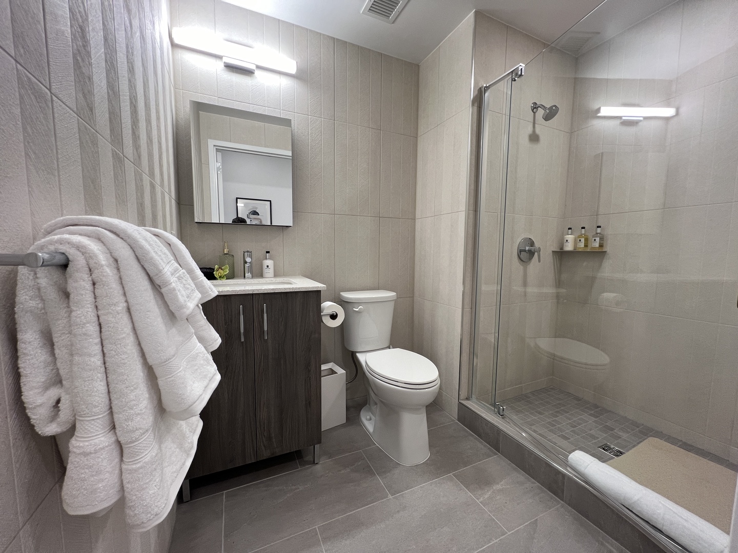 Wash up in the full bath, featuring a single vanity & glass shower