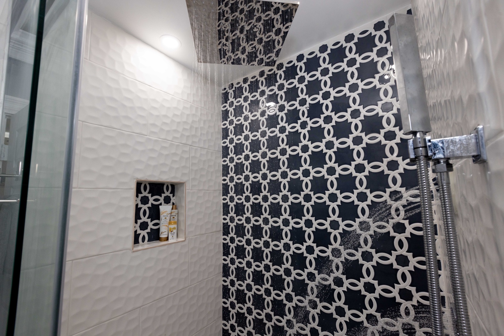 The queen en suite bathroom offers a single vanity, shower, & Jacuzzi tub