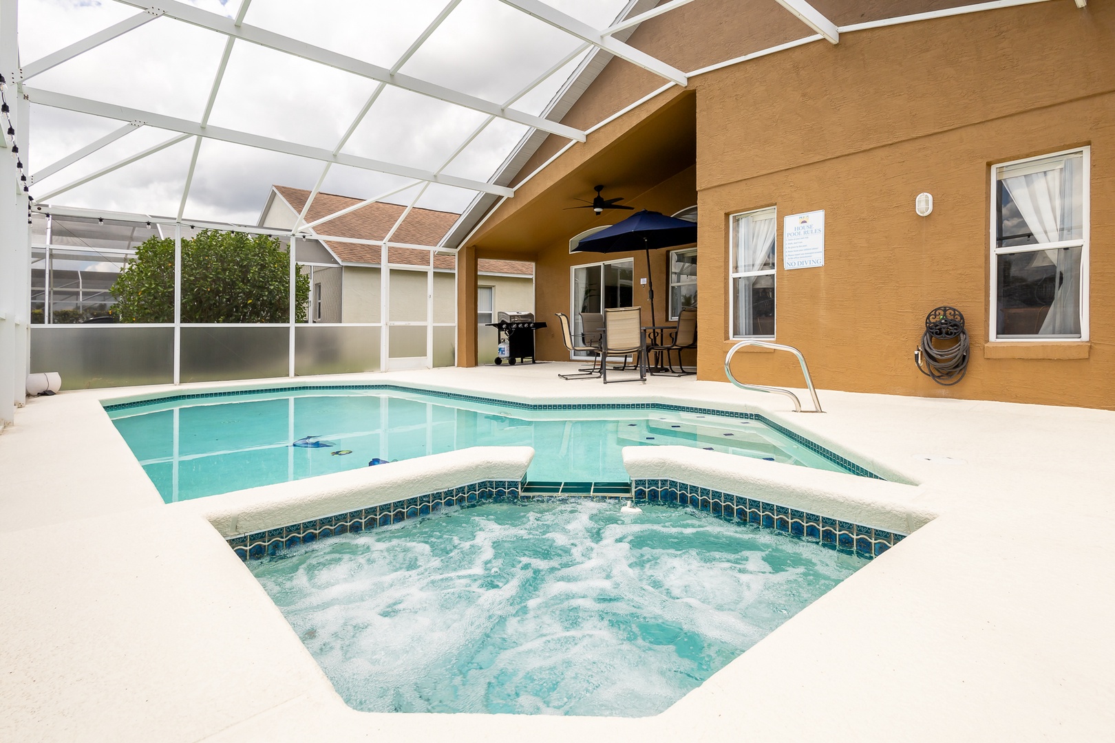 Relax in the luxurious private screened-in pool and spa area, perfect for a refreshing dip