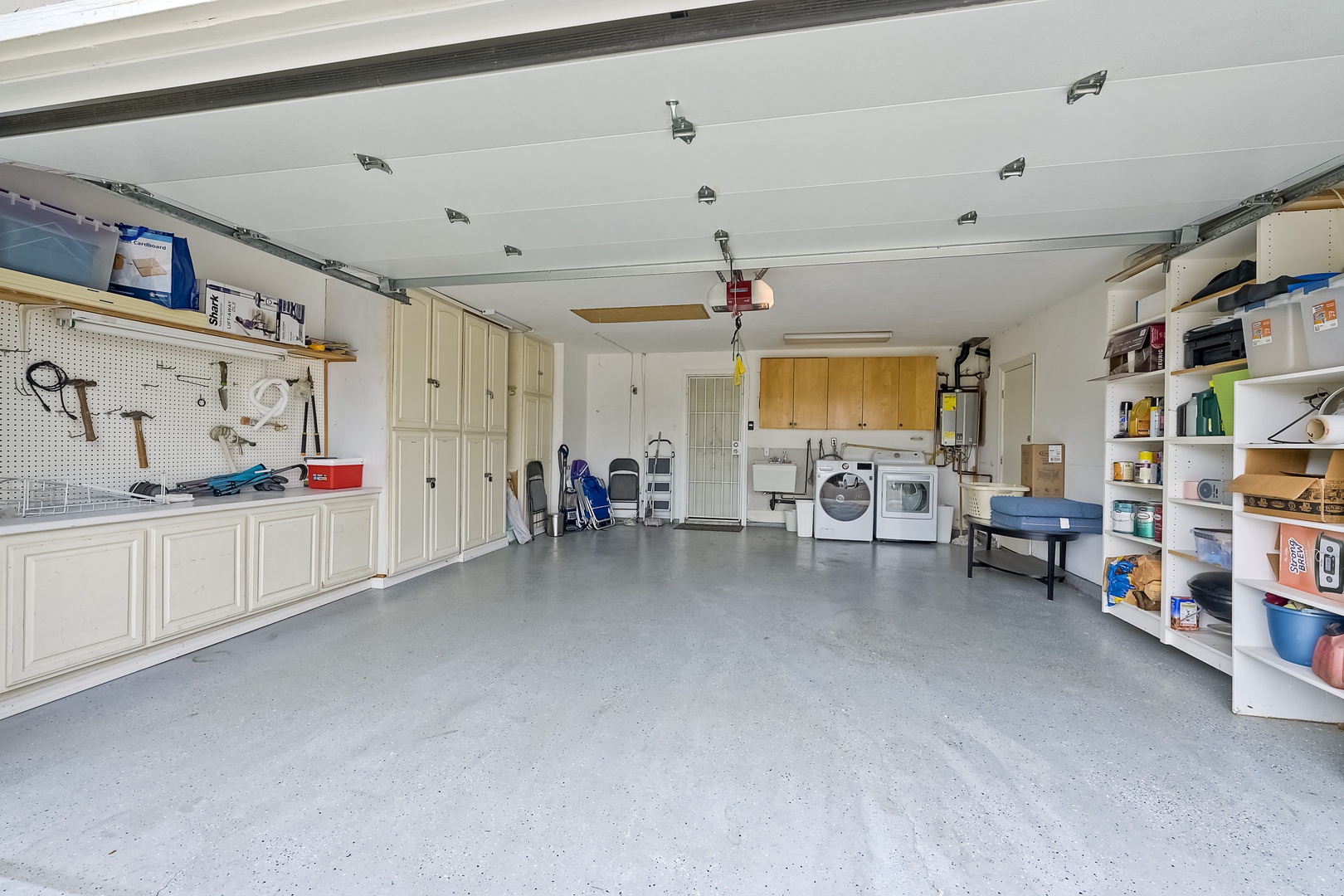 The spacious garage accommodates 1 vehicle & private laundry