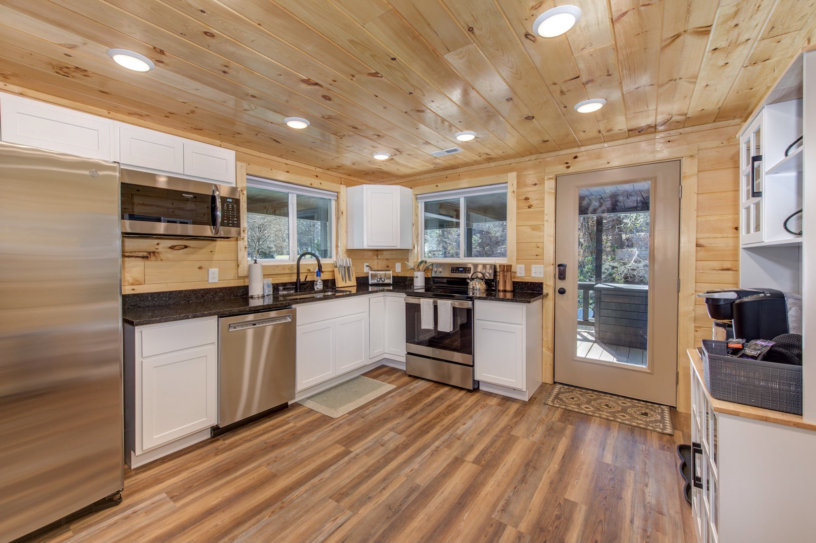 This open kitchen offers ample space & all the comforts of home