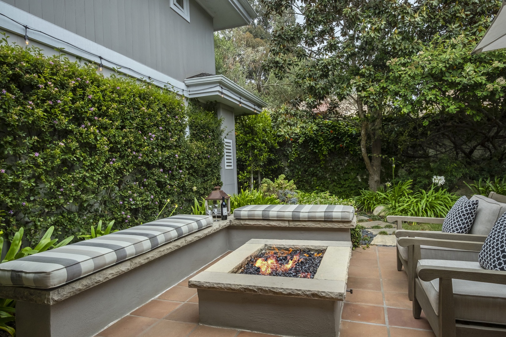Beautiful backyard with firepit, conversational seating, and BBQ