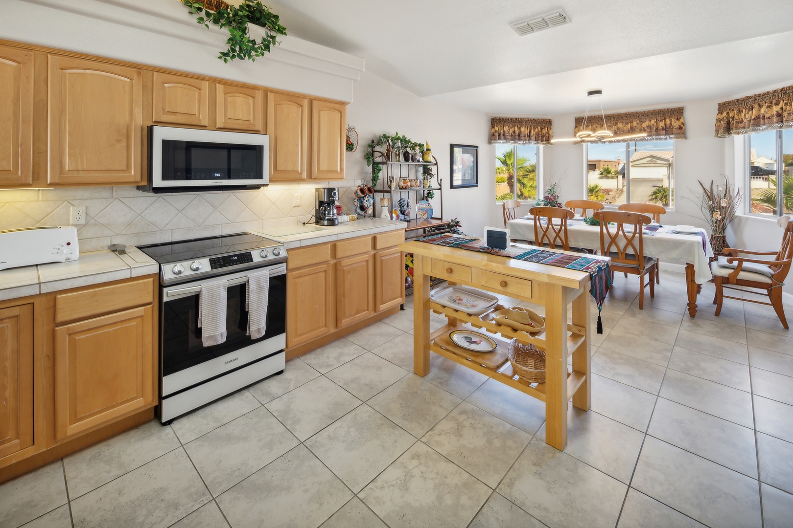 The open, airy kitchen offers ample space & all the comforts of home