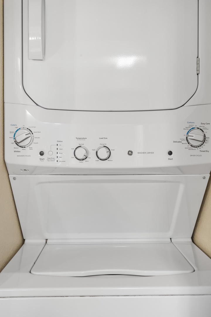 Stackable washer and dryer located within the unit