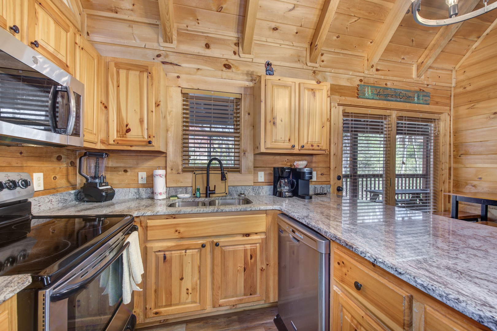 Kitchen with oven, microwave, blender, and drip coffee maker