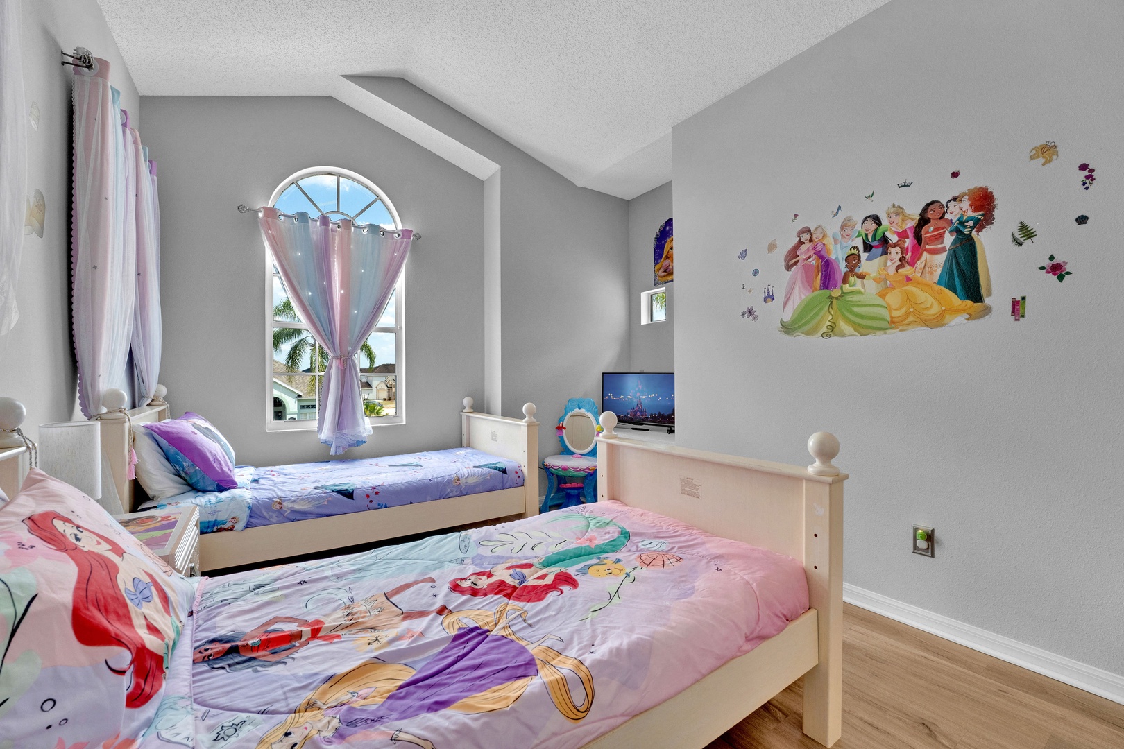 Bedroom 3 Disney Princess themed with 2 twin beds, and Smart TV