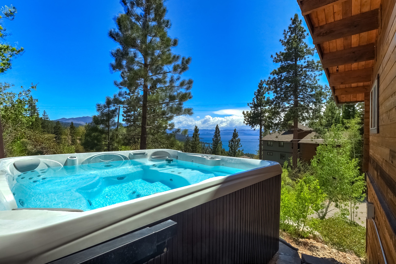 Private outdoor hot tub overlooking the lake