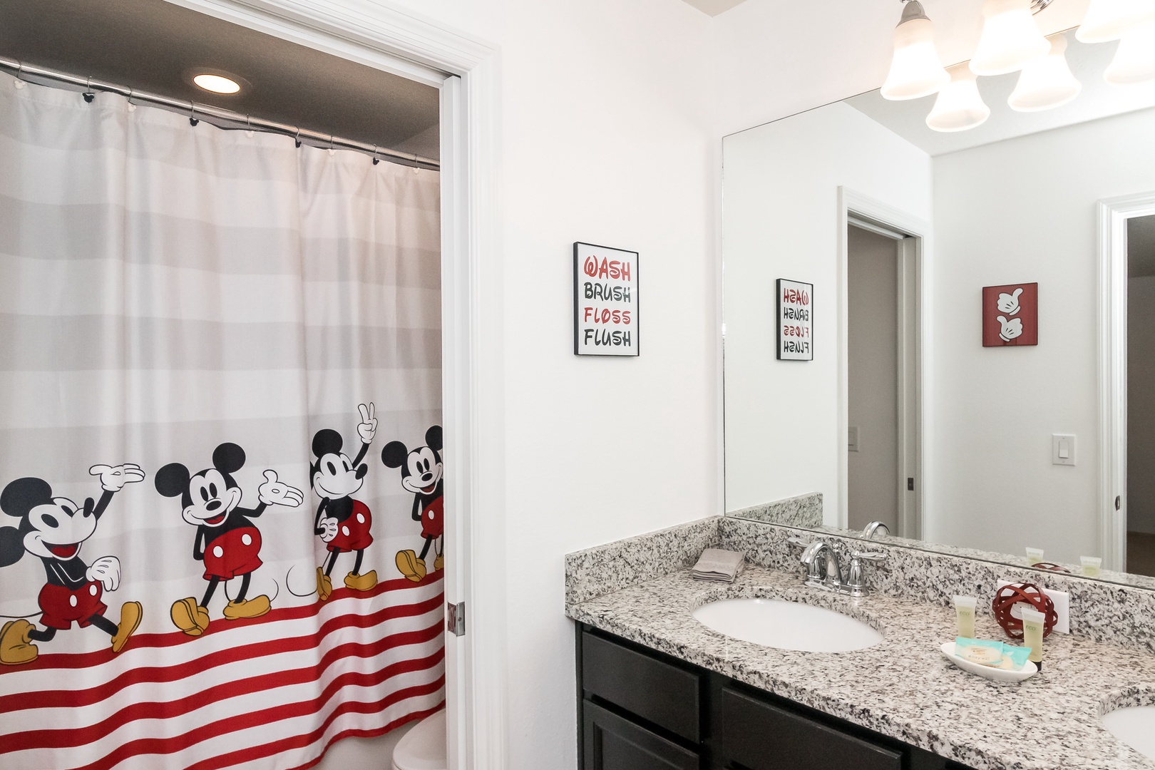 Bathroom 2 Mickey Mouse themed with shower/tub combo (2nd floor)