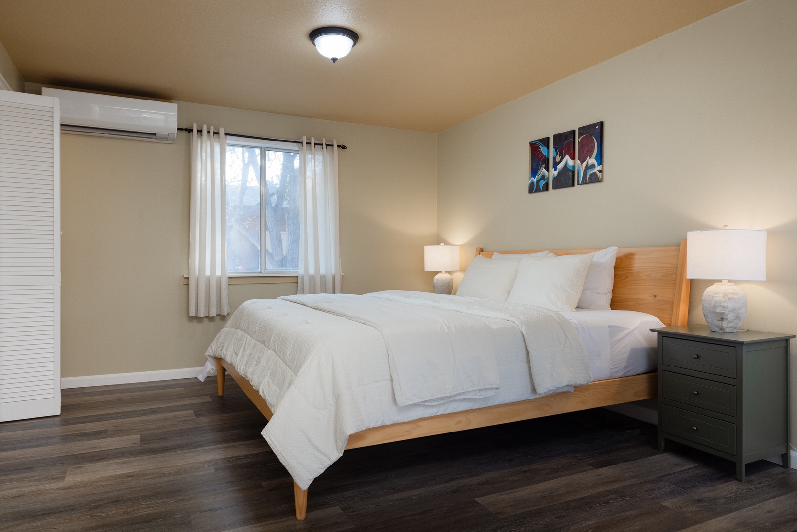 The serene king suite boasts an ensuite bath, desk workspace, & deck access