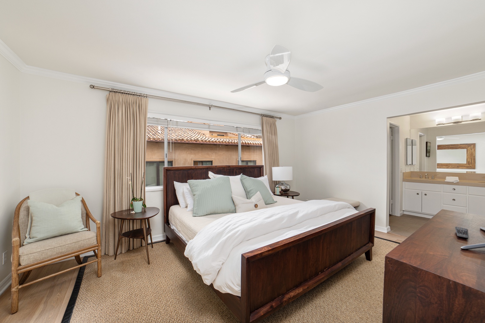 Recharge in the final bedroom, offering a king bed, smart TV, & ensuite