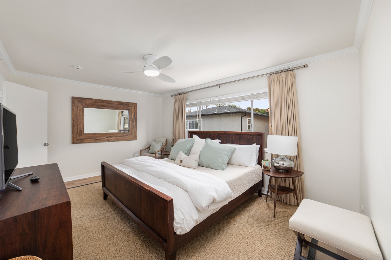 Recharge in the final bedroom, offering a king bed, smart TV, & ensuite